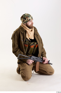 Andrew Elliott Insurgent Kneeling holding gun kneeling whole body 0007.jpg